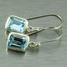 Cargar imagen en el visor de la galería, Small blue topaz, emerald cut silver earrings.