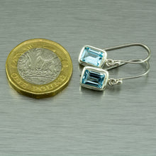 Cargar imagen en el visor de la galería, Small blue topaz, emerald cut silver earrings.