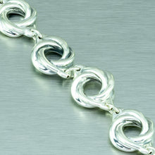 Load image into Gallery viewer, Eight sterling silver spirals make up this pretty linked sterling silver bracelet