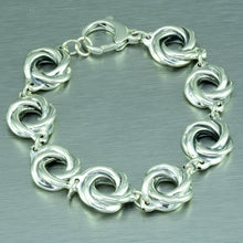 Load image into Gallery viewer, Eight sterling silver spirals make up this pretty linked sterling silver bracelet