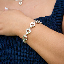 Load image into Gallery viewer, Eight sterling silver spirals make up this pretty linked sterling silver bracelet