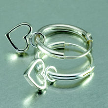 Load image into Gallery viewer, Small silver hoop earrings with tiny dangly heart.