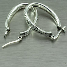 Cargar imagen en el visor de la galería, Large, oval hoop earrings with a Greek key motif design