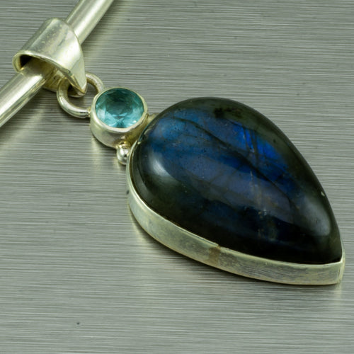 Labradorite pear pendant with blue topaz feature stone