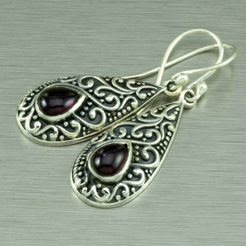 Sterling silver filigree earrings set with teardop garnets