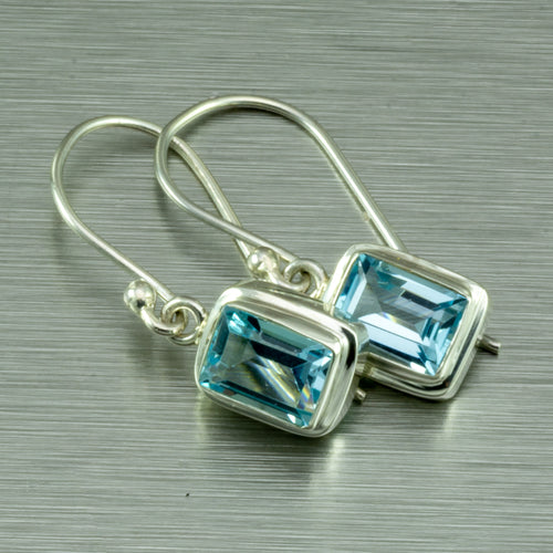 Small blue topaz, emerald cut silver earrings.