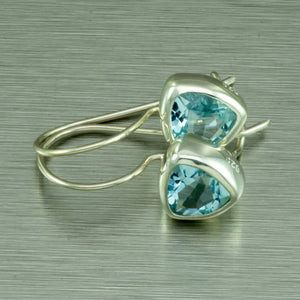 Blue topaz trillion cut silver earrings.