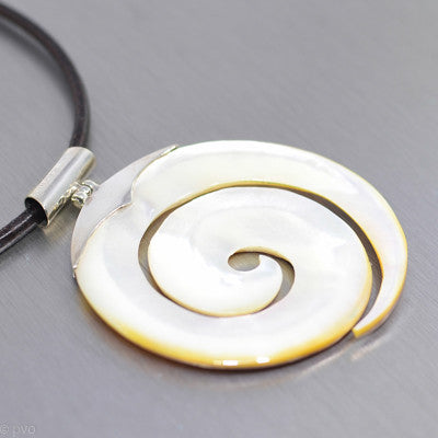Cream carved spiral mother of pearl large pendant with silver bail.