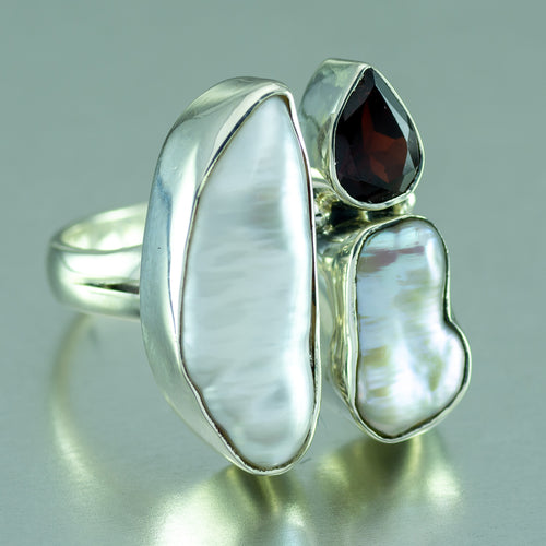 Biwa pearl and garnet three stone silver ring.