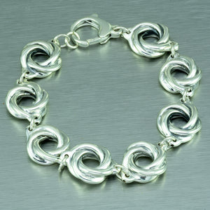 Eight sterling silver spirals make up this pretty linked sterling silver bracelet