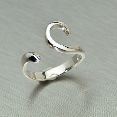 Sterling silver delicate, open sided curl ring.