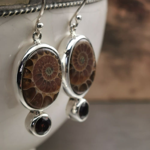 Ammonite fossil and garnet dangly earrings in sterling silver