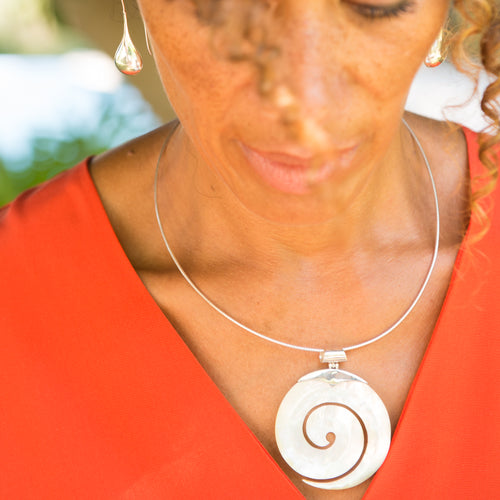 Cream carved spiral mother of pearl large pendant with silver bail.