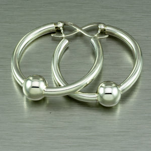 Integrated ball round hoop sterling silver earrings.