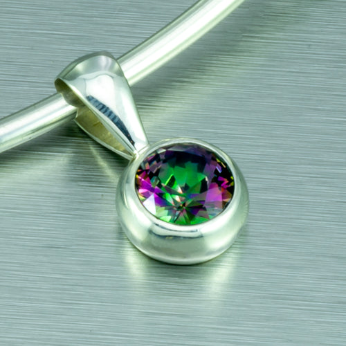 Small round mystic topaz pendant.