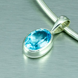 Blue topaz large oval sterling silver pendant.