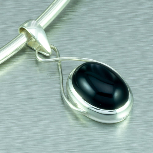Onyx oval wire-set silver pendant